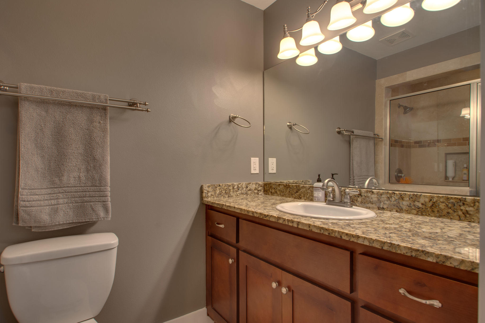1146 Bay Court Destin, FL 32541 - Photo 19 of 32 a bathroom with a granite countertop sink toilet and shower