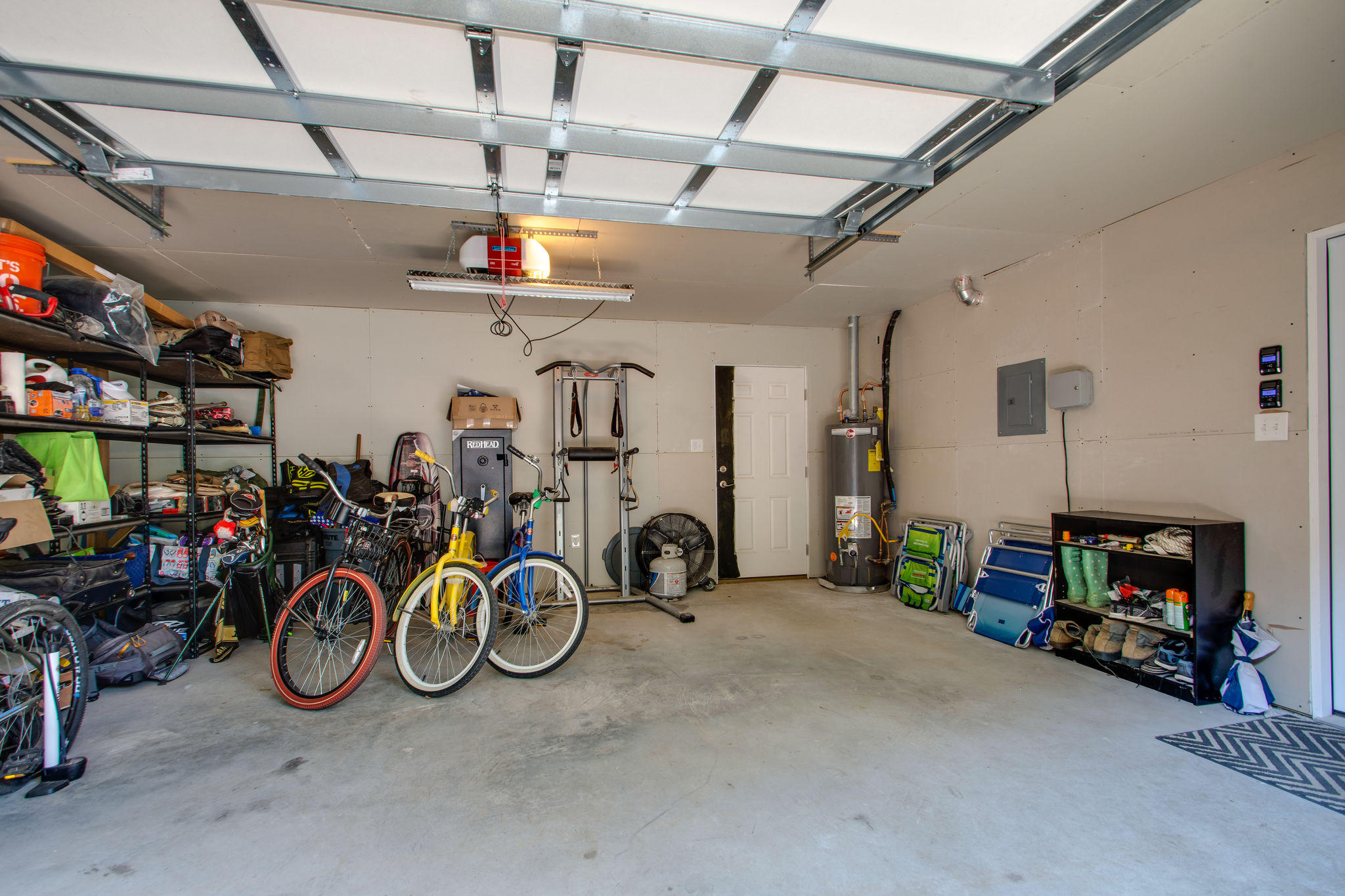 1146 Bay Court Destin, FL 32541 - Photo 25 of 32 a view of a garage with a bike and car