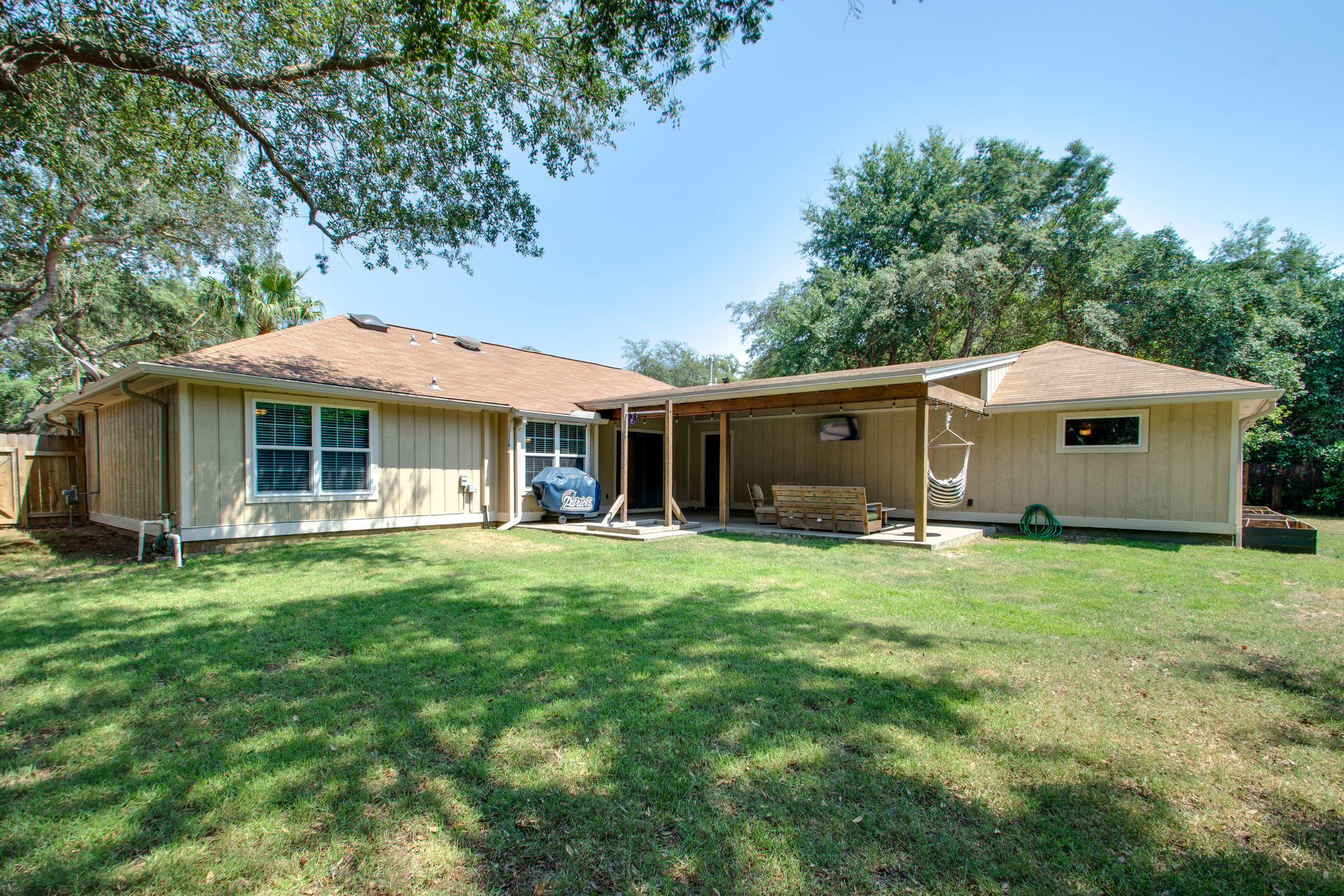 1146 Bay Court Destin, FL 32541 - Photo 29 of 32 a front view of a house with a garden