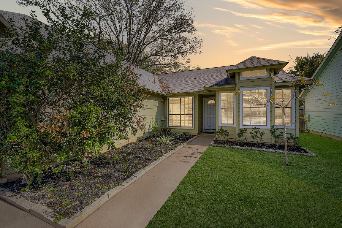 9839 Briar Ridge Drive Austin, TX 78748 - Photo 3 of 28 View of front of home featuring a yard and a shingled roof
