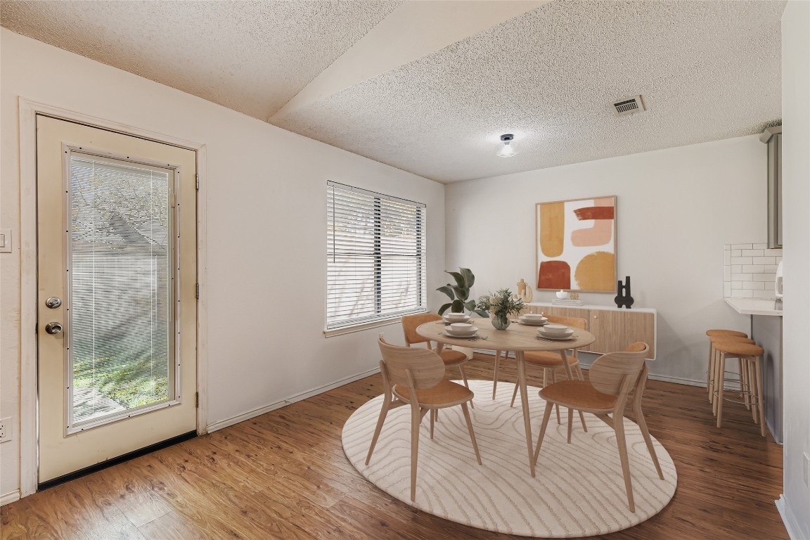 9839 Briar Ridge Drive Austin, TX 78748 - Photo 7 of 28 Dining space with a textured ceiling and wood finished floors