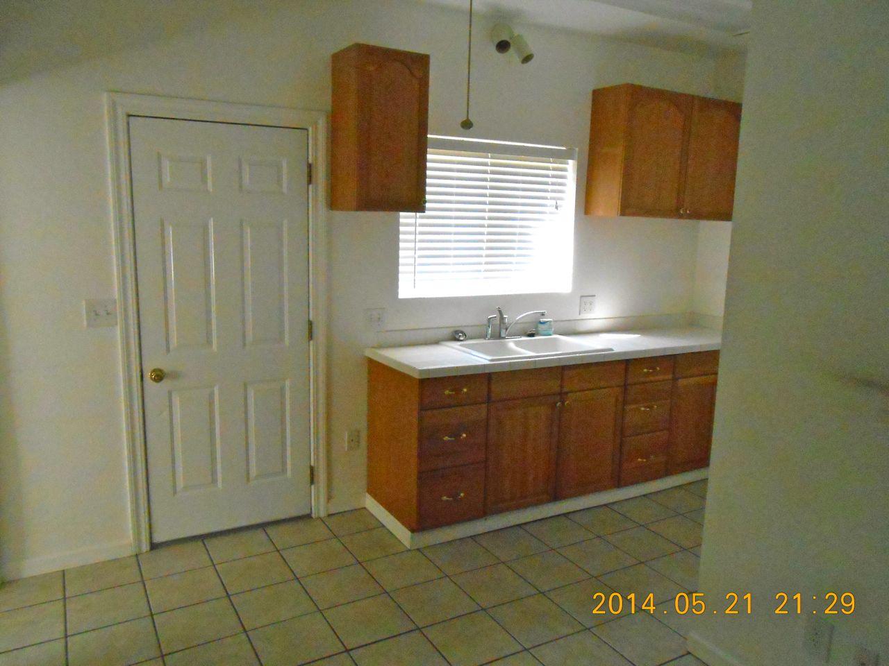 7072 Pit Road Redding, CA 96001 - Photo 16 of 20 a bathroom with a granite countertop sink and a mirror
