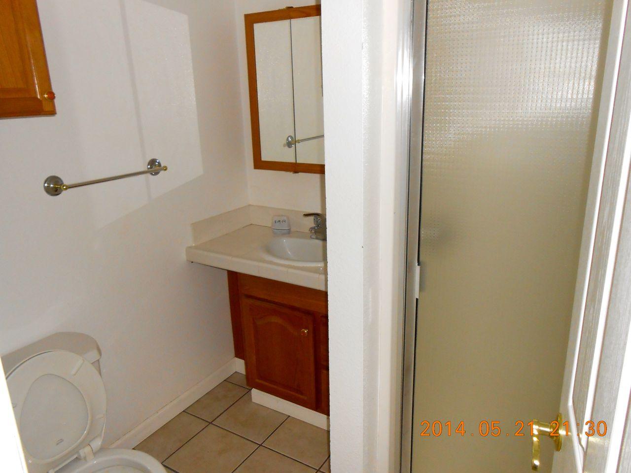 7072 Pit Road Redding, CA 96001 - Photo 17 of 20 a bathroom with a sink and a mirror