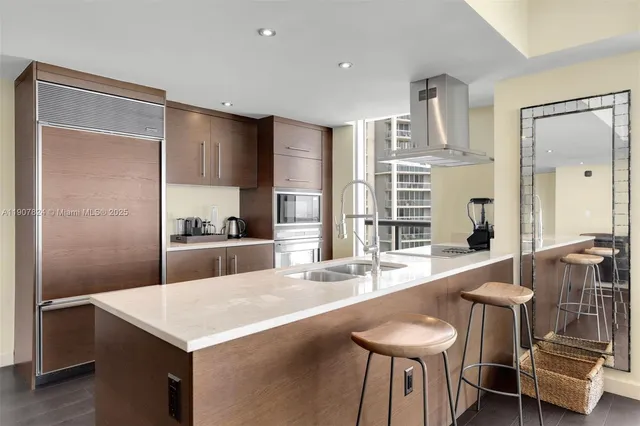 a bathroom with double vanity sinks and a mirror