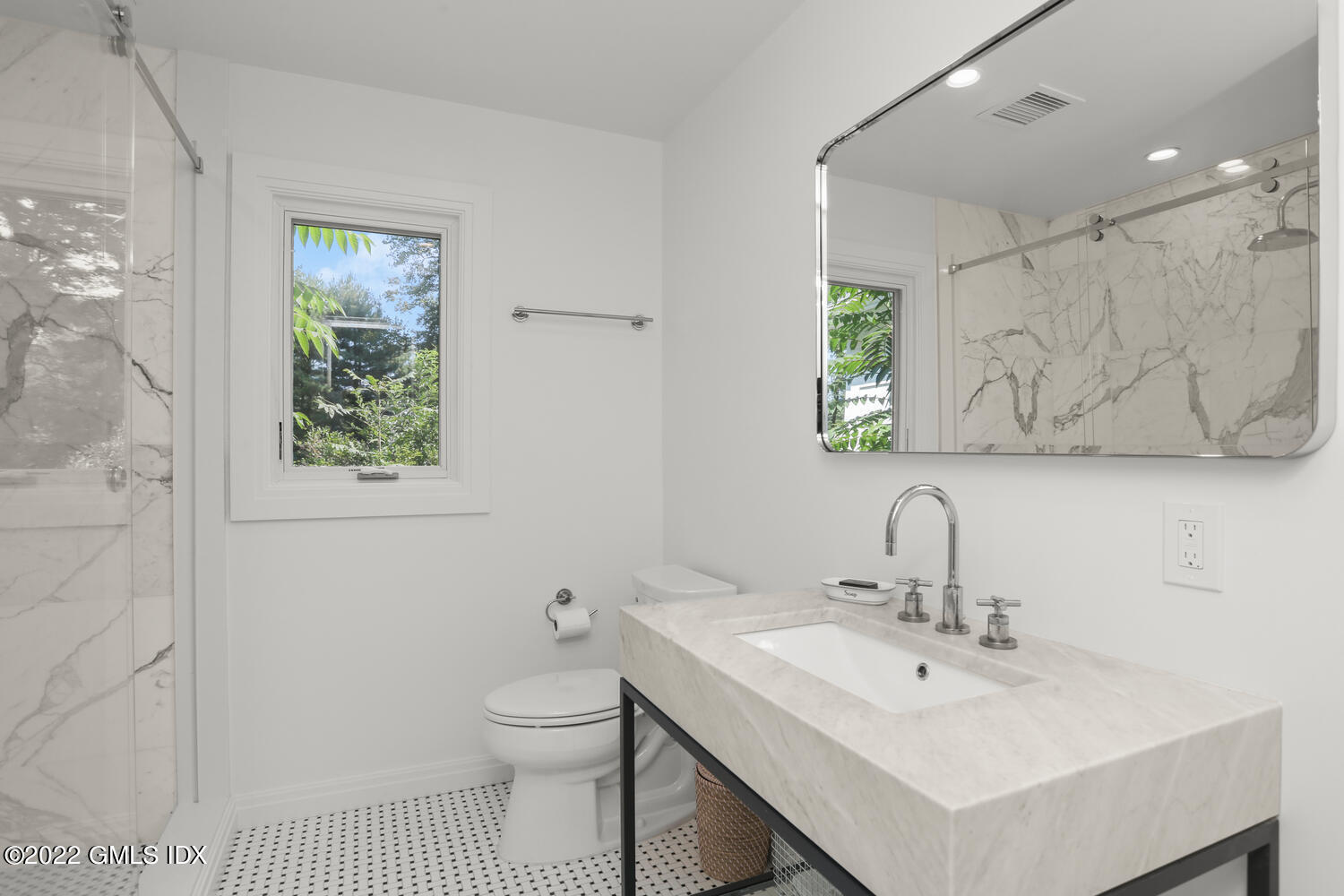 609 Round Hill Road Greenwich, CT 06831 - Photo 15 of 25 a bathroom with a sink a toilet and a mirror