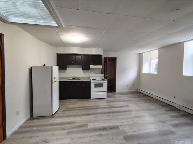 a kitchen with stainless steel appliances a refrigerator and a stove