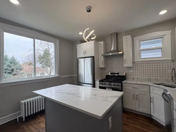 a kitchen that has a cabinets and a stove