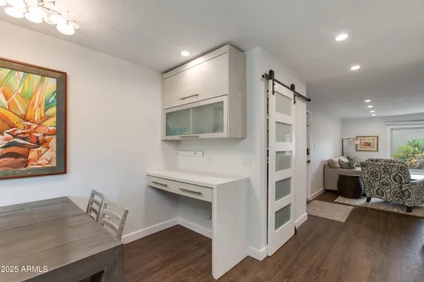 a living room with furniture and a rug