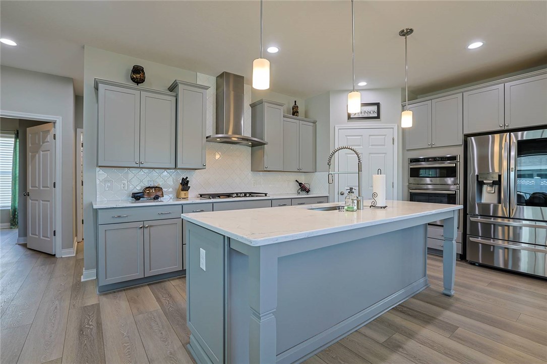 5013 Arena Court Hamilton, OH 45011 - Photo 11 of 41 This bright kitchen features sleek appliances and a spacious island for culinary creativity.
