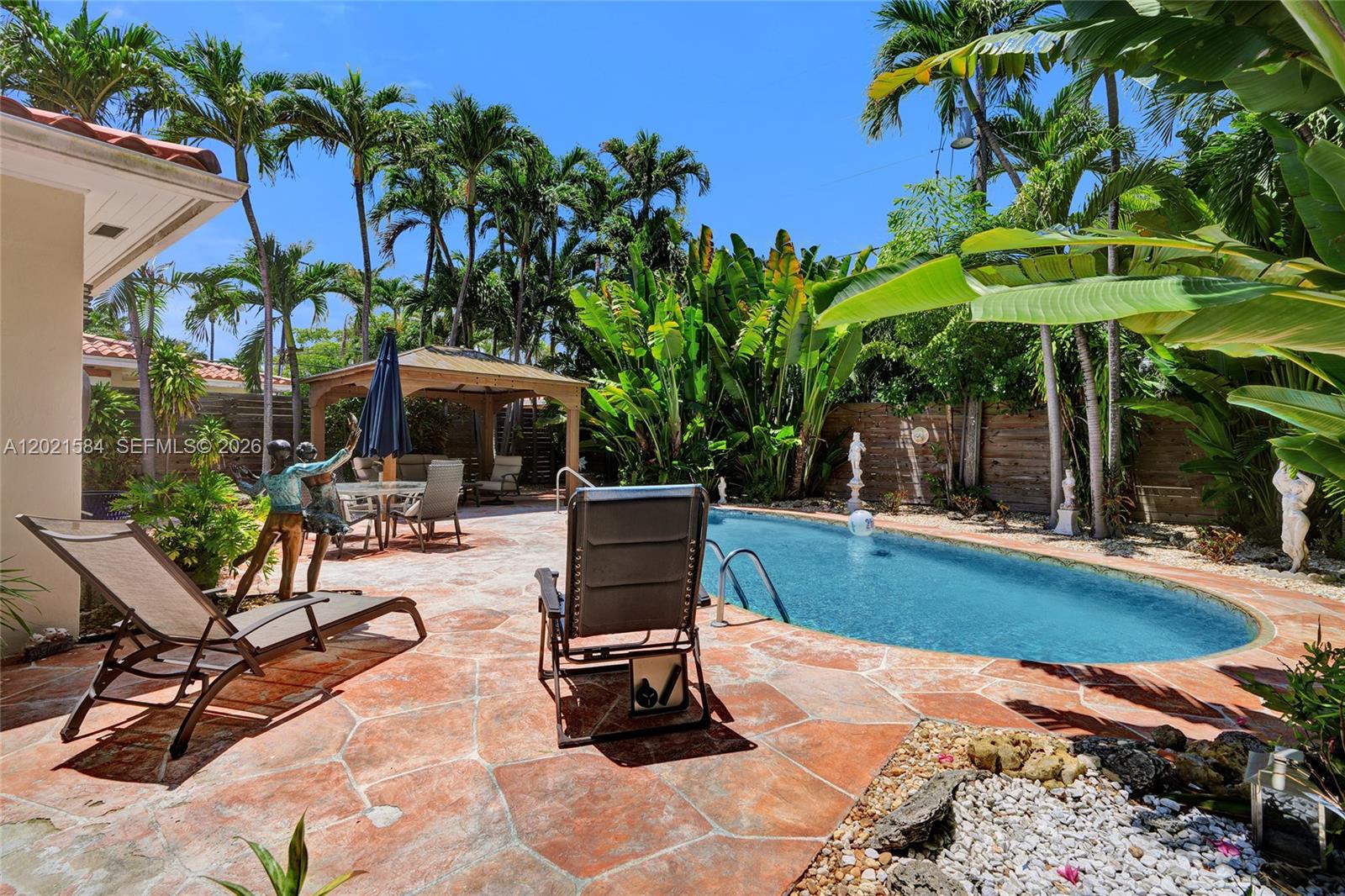 811 Northeast 73rd Street Miami, FL 33138 - Photo 32 of 51 a view of a backyard with sitting area