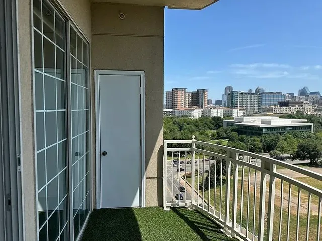 a view of a balcony with city view