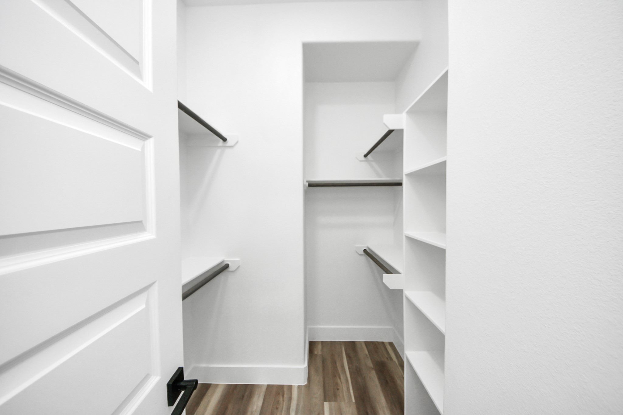 2014 Blodgett Street Houston, TX 77004 - Photo 28 of 49 a view of walk in closet with empty racks