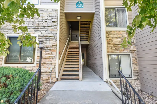 a view of a brick house with an outdoor space