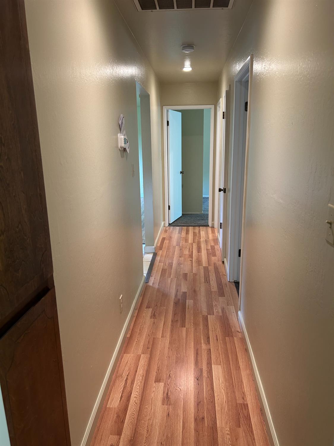 413 Shakeley Lane Ione, CA 95640 - Photo 9 of 11 a view of wooden floor in a bathroom