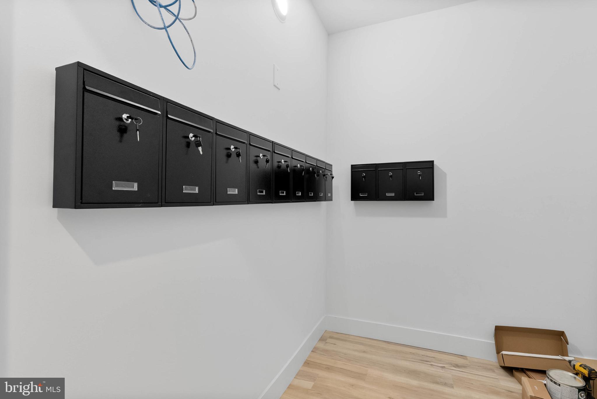 809 Diamond Street, Unit A101 Philadelphia, PA 19122 - Photo 13 of 17 a view of an empty room with wooden floor