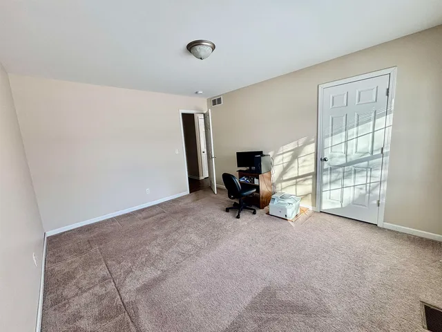 a view of livingroom with furniture and a window