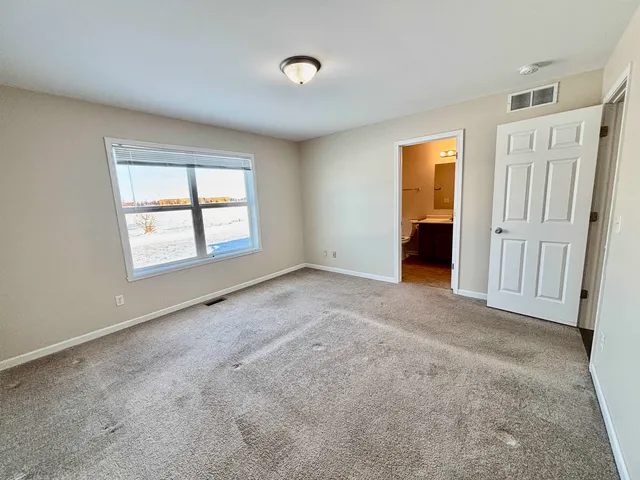 a bathroom with a sink mirror vanity and toilet
