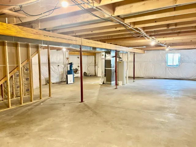 a view of a house with a backyard and a tree