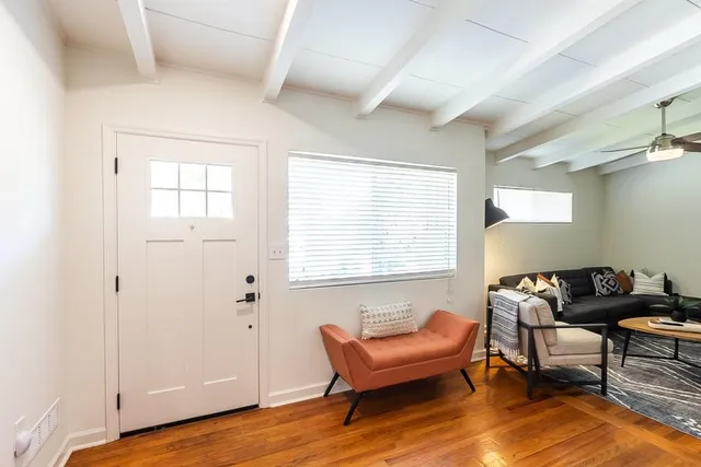 a livingroom with furniture and a window