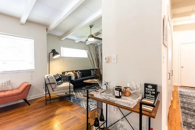 a living room with furniture and a rug