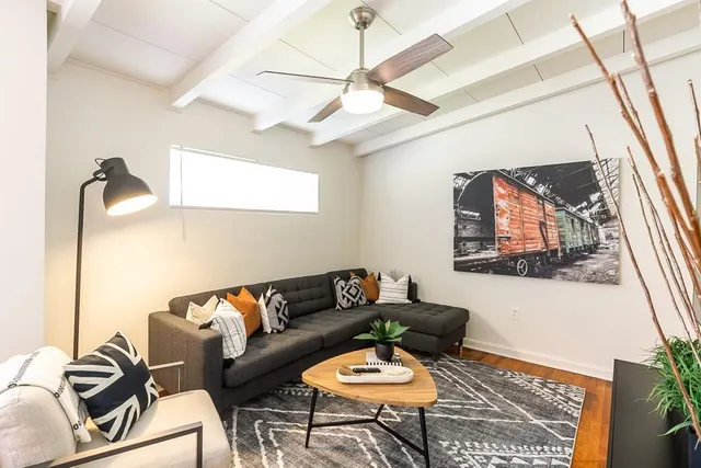 a living room with furniture and a large window