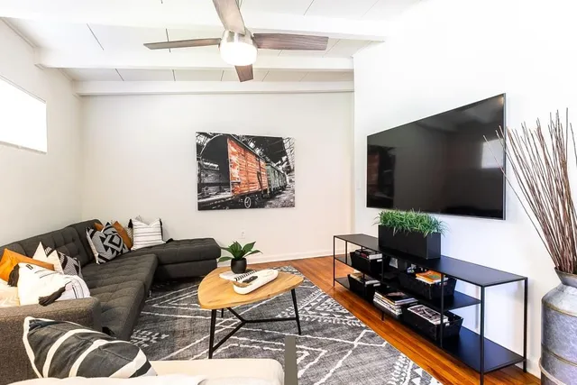 a view of a livingroom with furniture and wooden floor