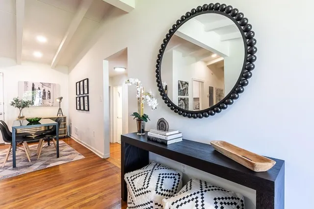 a workspace room with furniture and wooden floor