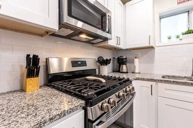 a kitchen with a sink and a window