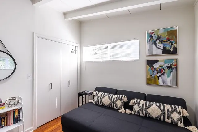 a white toilet sitting next to a bathroom sink