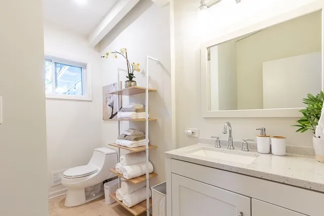a view of a livingroom with furniture and a table