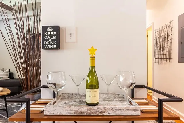 a balcony with wooden floor and outdoor seating