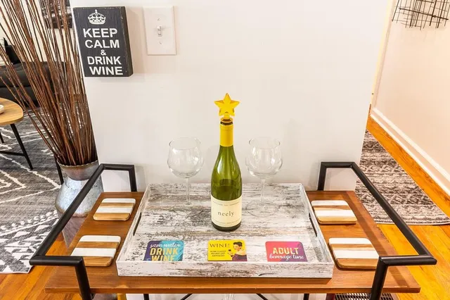 a view of a patio with a table chairs and a backyard
