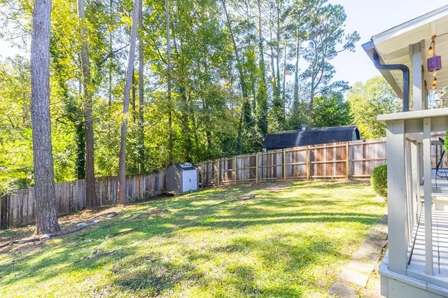 a front view of a building with lot of cars