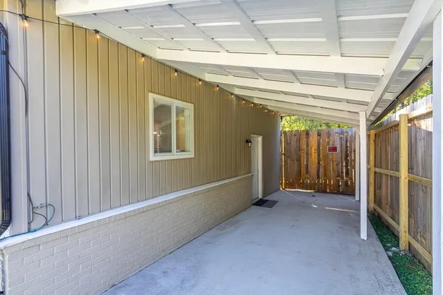 a front view of a house with outdoor seating and plants