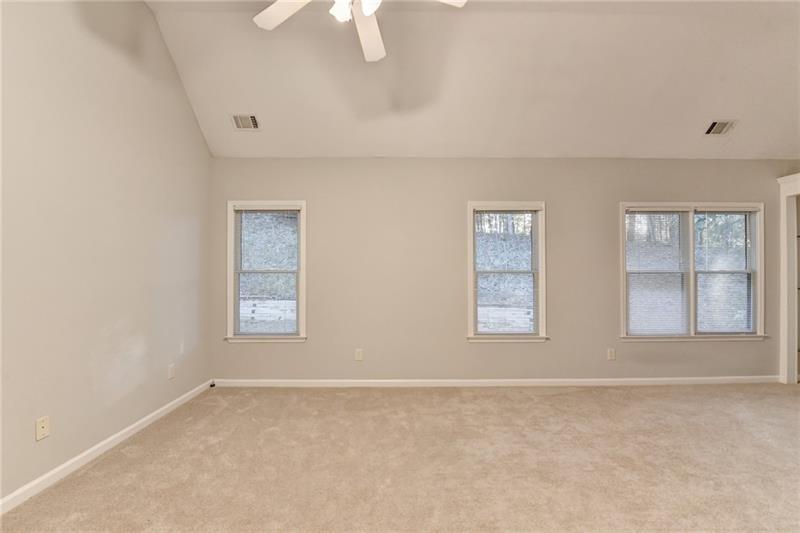 655 Golden Meadows Lane Suwanee, GA 30024 - Photo 28 of 73 a view of an empty room with a window