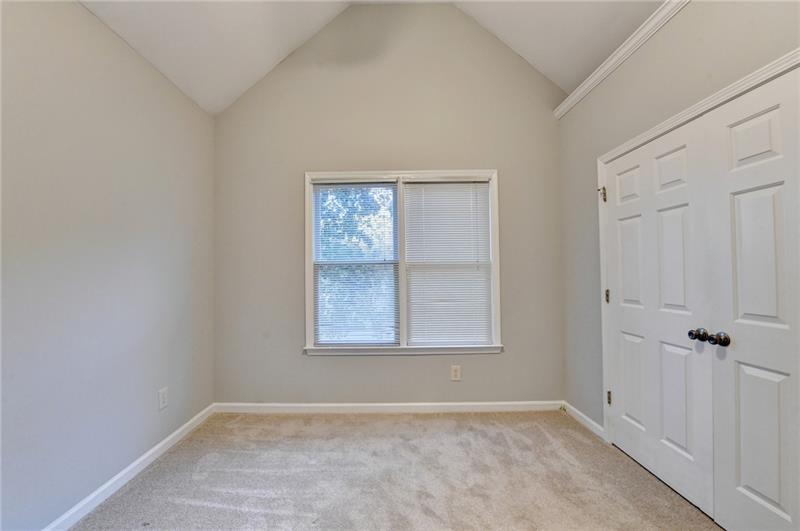 655 Golden Meadows Lane Suwanee, GA 30024 - Photo 40 of 73 an empty room with windows