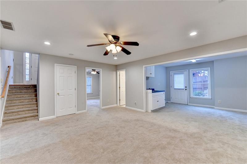 655 Golden Meadows Lane Suwanee, GA 30024 - Photo 48 of 73 an empty room with windows and a ceiling fan