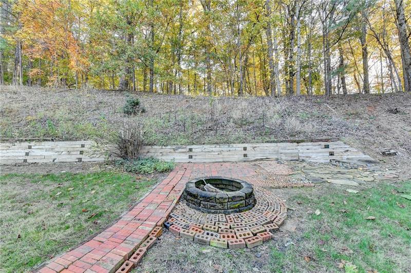 655 Golden Meadows Lane Suwanee, GA 30024 - Photo 59 of 73 a view of a backyard with trees