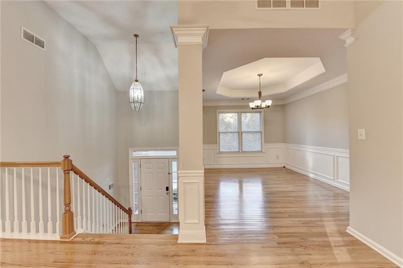 655 Golden Meadows Lane Suwanee, GA 30024 - Photo 6 of 73 a view of a room with wooden floor and white walls