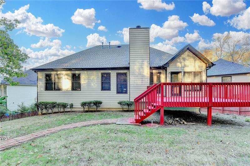 655 Golden Meadows Lane Suwanee, GA 30024 - Photo 61 of 73 a view of a house with a backyard
