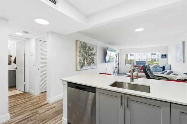 a room with sink and mirror