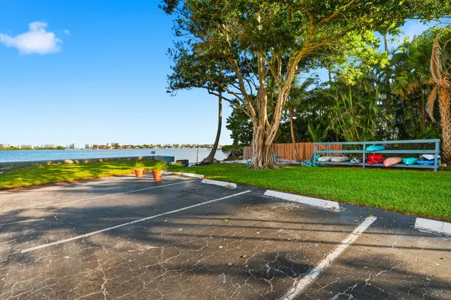 a view of a swimming pool and a yard