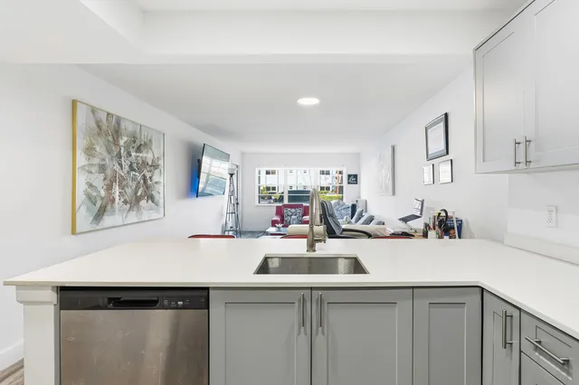 a kitchen with a sink and cabinets