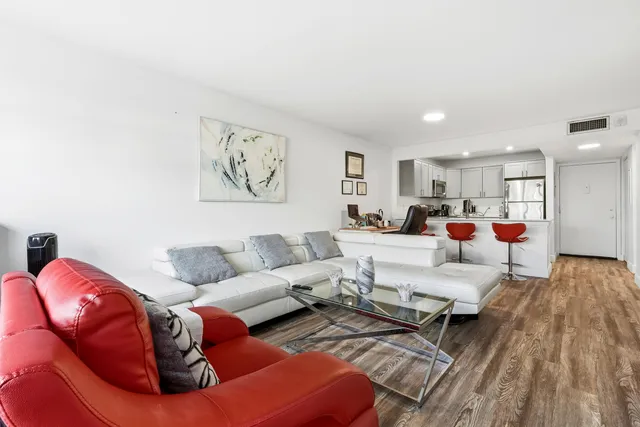 a living room with furniture and a couch