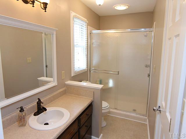 8312 Kestrel Drive Raleigh, NC 27615 - Photo 19 of 24 WONDERFUL BRIGHT BEDROOM WITH WALK IN CLOSET LOCATED AT END OF HALLWAY MAXIMIZES PRIVACY FOR GUESTS