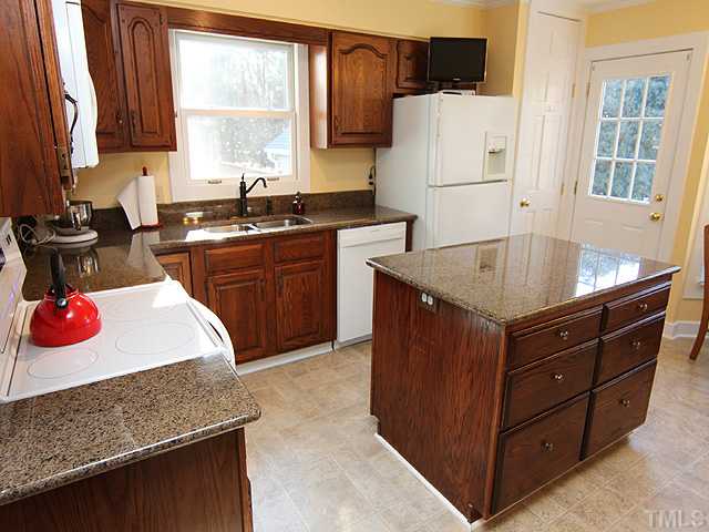 8312 Kestrel Drive Raleigh, NC 27615 - Photo 10 of 24 BRIGHT SUNLIT KITCHEN WITH BAY WINDOW AND KITCHEN NOOK
