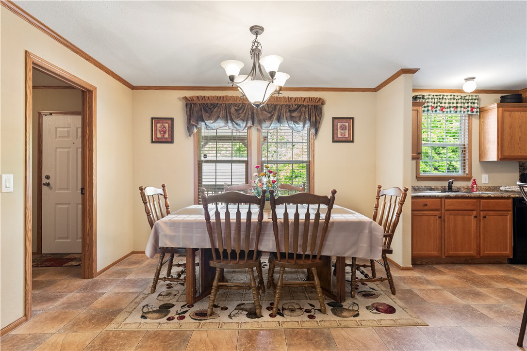 265 A State Rd S-37-141 Westminster, SC 29693 - Photo 13 of 33 A classic dining area provides a welcoming space for meals, featuring durable flooring and a connecting kitchen view.