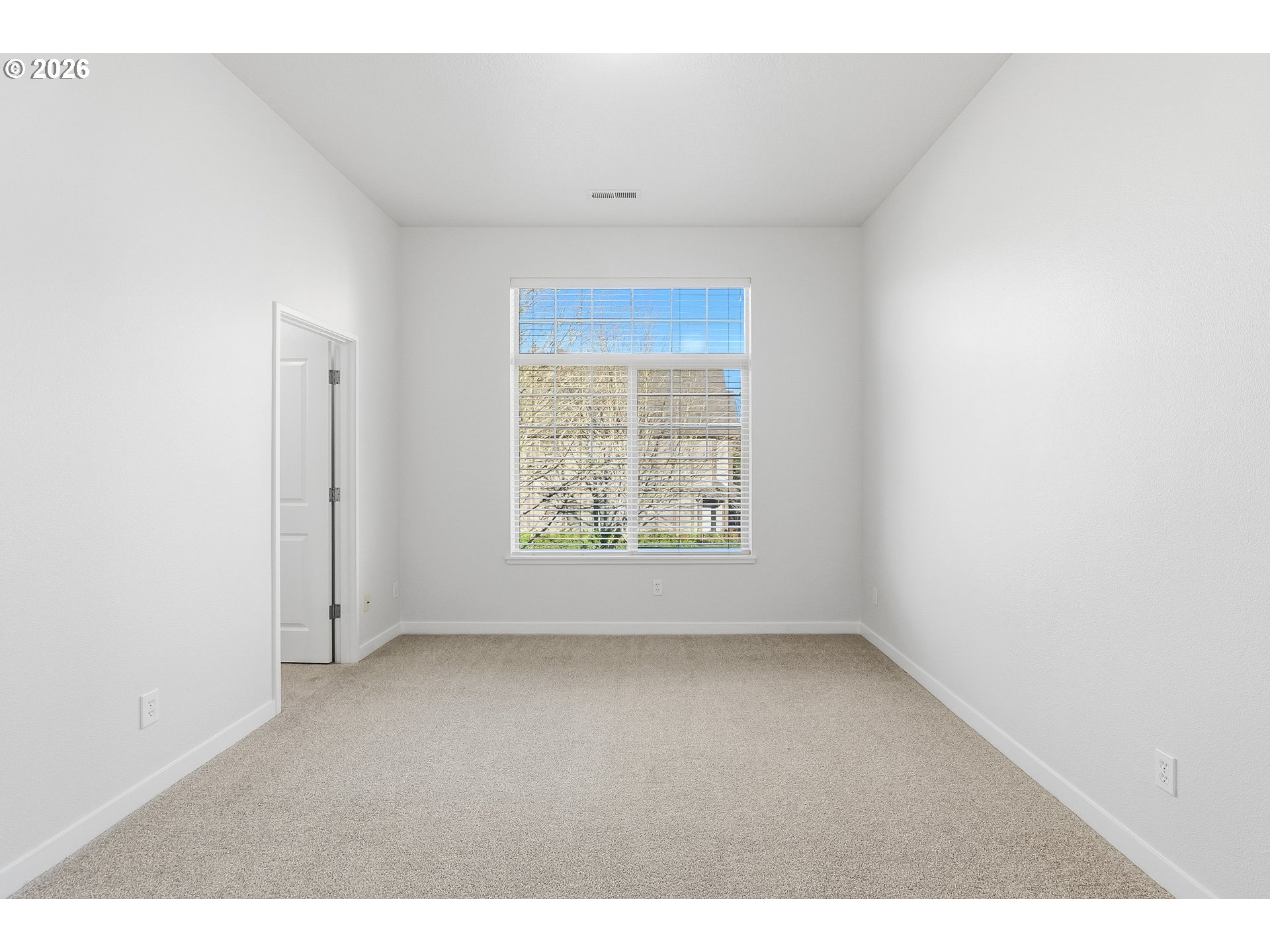 16012 Northwest Centine Lane Portland, OR 97229 - Photo 16 of 24 a view of an empty room with a window