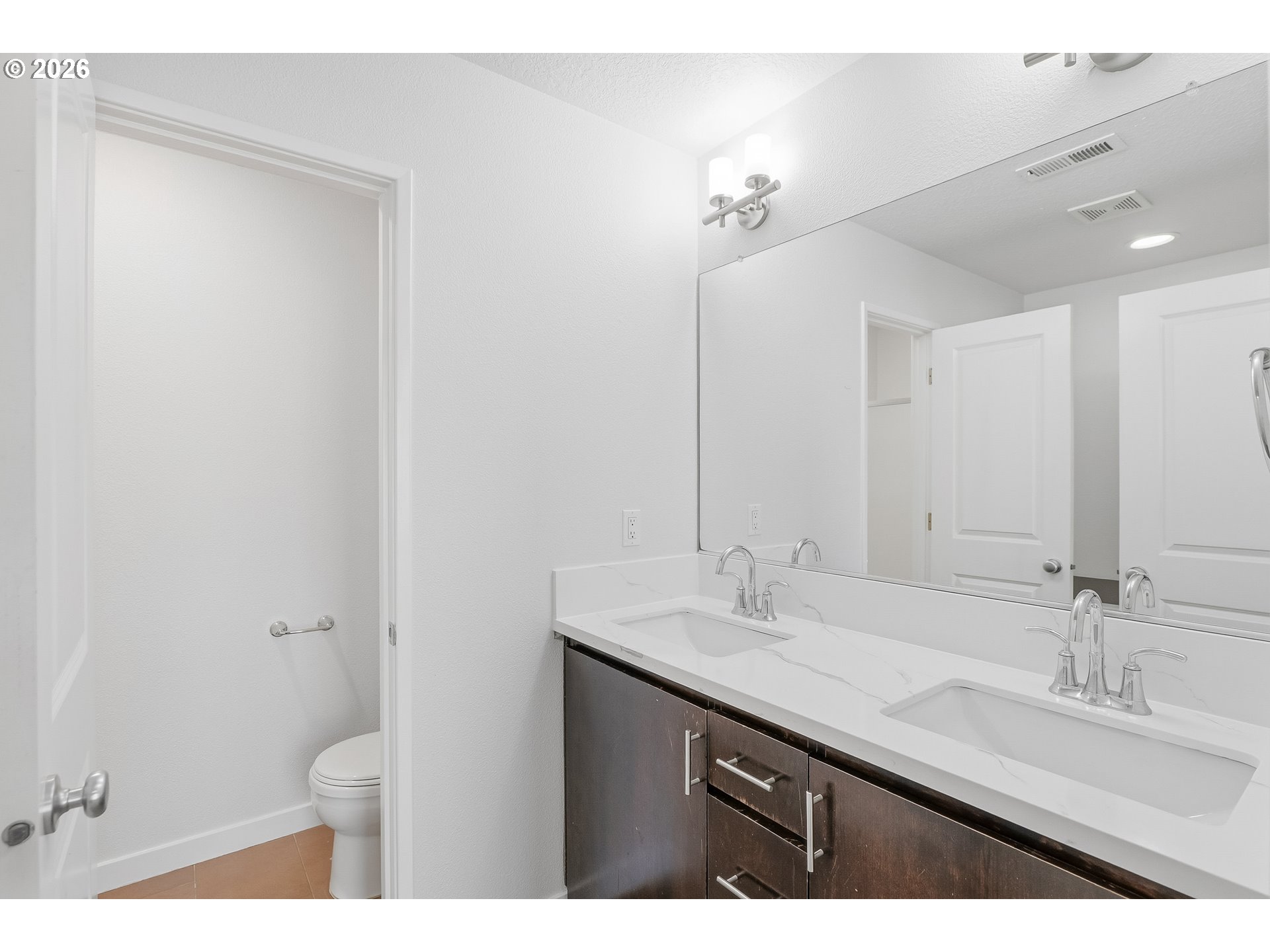 16012 Northwest Centine Lane Portland, OR 97229 - Photo 17 of 24 a bathroom with a sink a toilet and a mirror