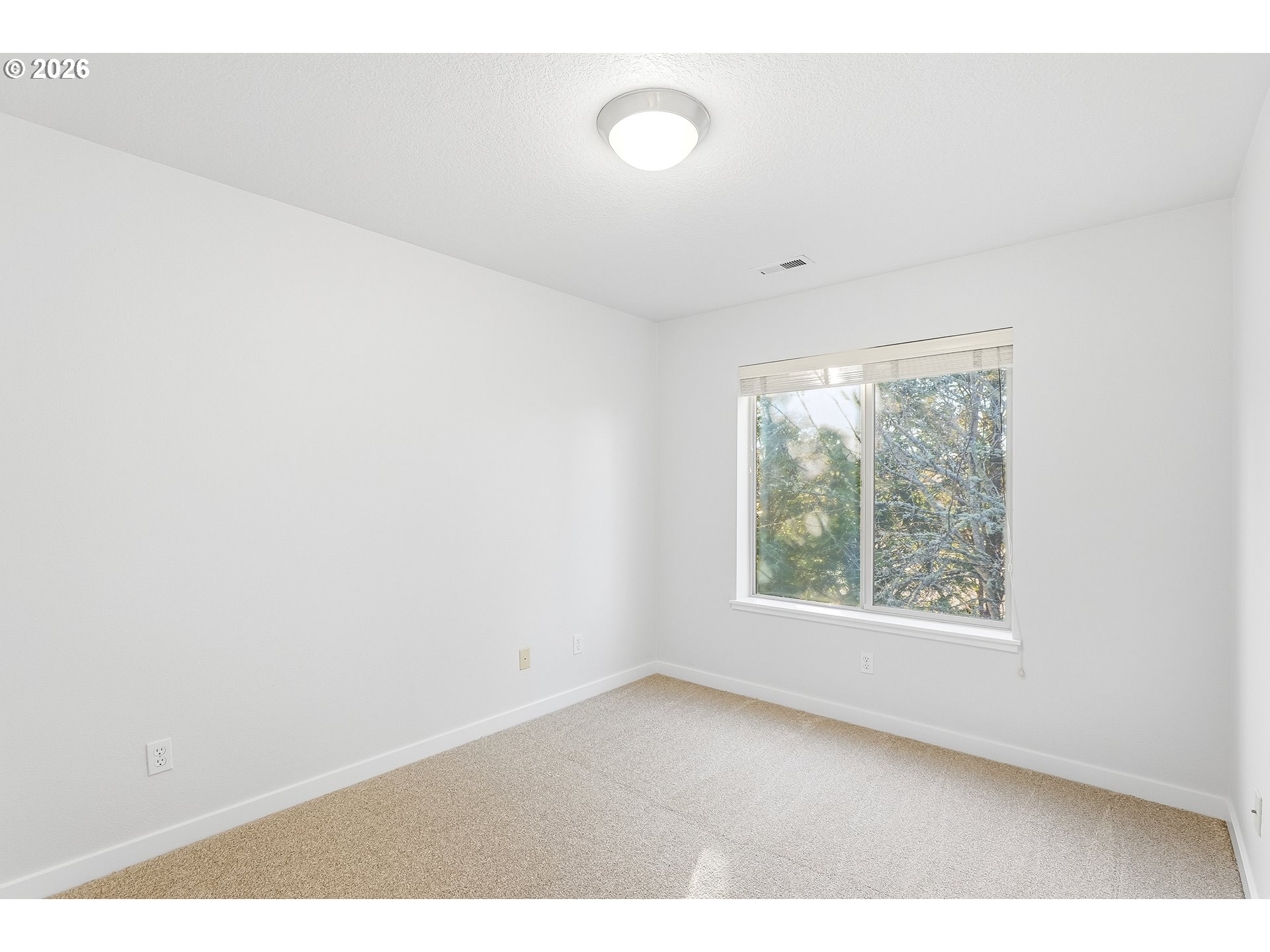 16012 Northwest Centine Lane Portland, OR 97229 - Photo 20 of 24 a view of an empty room with a window